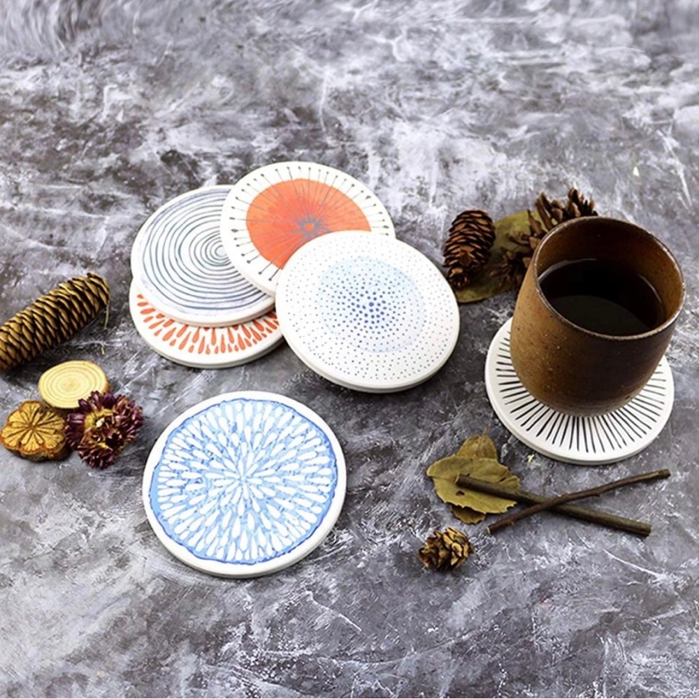 Brand new- Set of 6 colorful ceramic coasters with cork base.